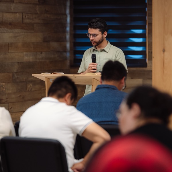 Pastor Kennedy preaching at Victory Faith Church